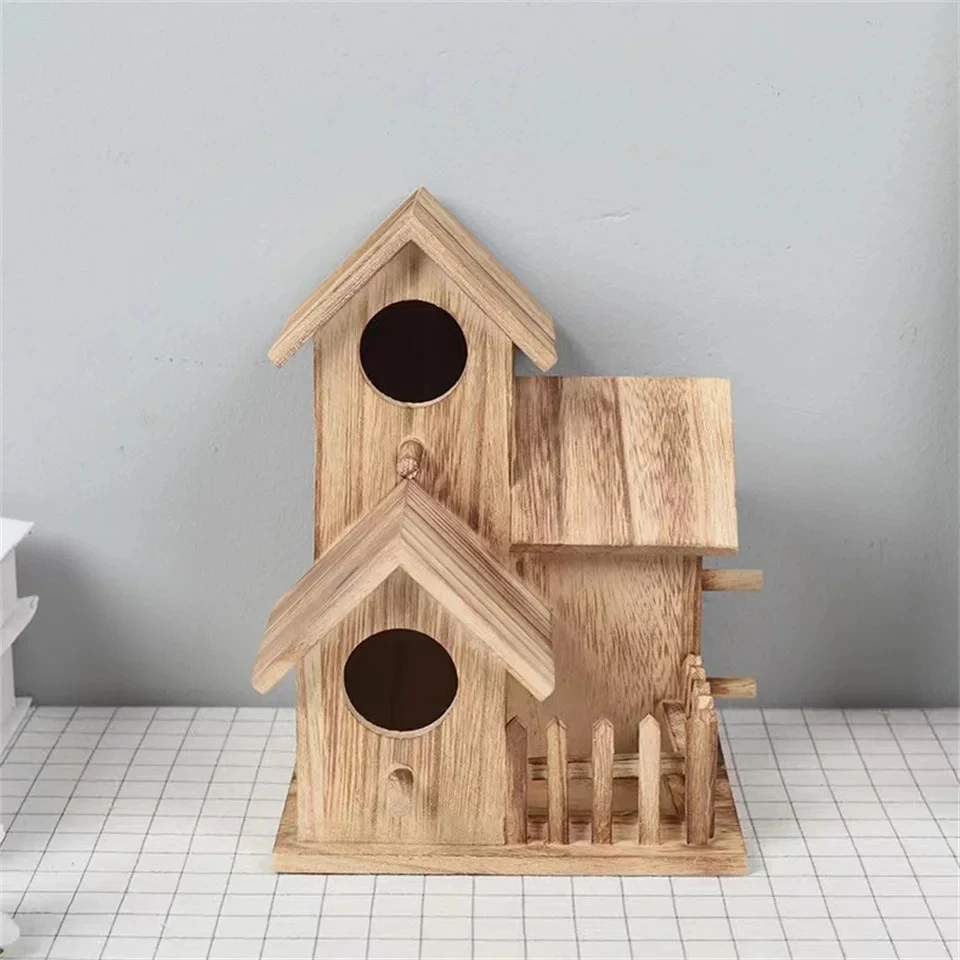 Houten doe-het-vogelhuis